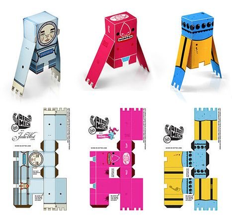 Three assembled Readymech paper toys standing above their flat printable templates